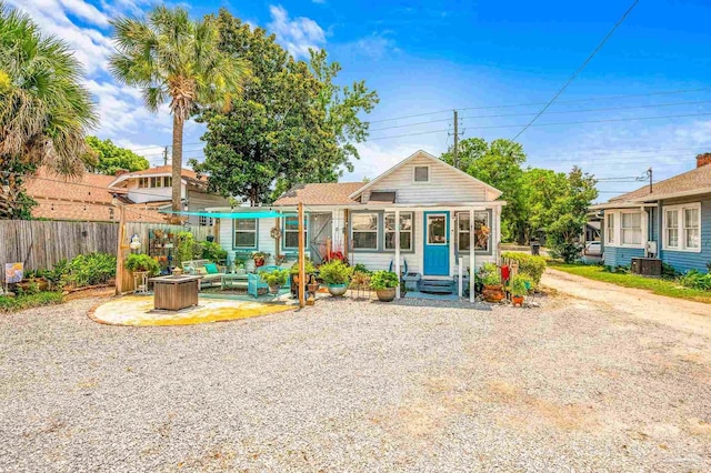 1220 E Cervantes, Pensacola, FL 32501 - view of front of property featuring entry steps, cooling unit, an outdoor living space with a fire pit, and driveway