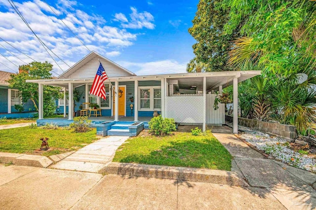 1220 E Cervantes, Pensacola, FL 32501 - view of front facade with a porch and a front yard