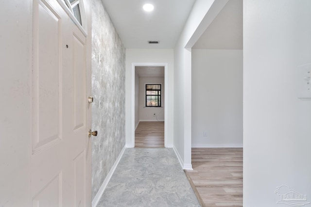 hallway with light wood-type flooring