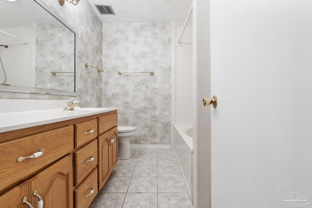 full bathroom with tile patterned floors, toilet, shower / bathing tub combination, and vanity