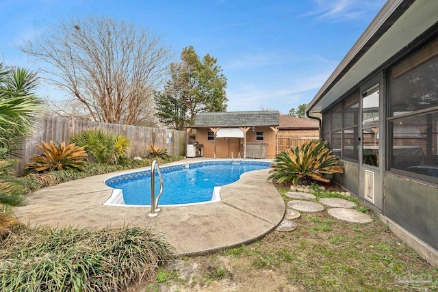 view of pool featuring an outdoor structure and a patio area