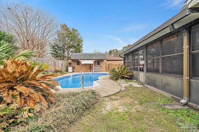 view of swimming pool with an outbuilding