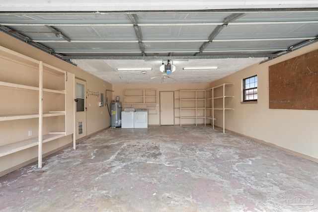 garage featuring a garage door opener, separate washer and dryer, and electric water heater