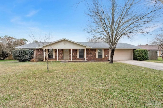 ranch-style home with a garage and a front yard