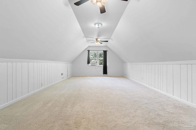 bonus room featuring lofted ceiling, ceiling fan, and carpet