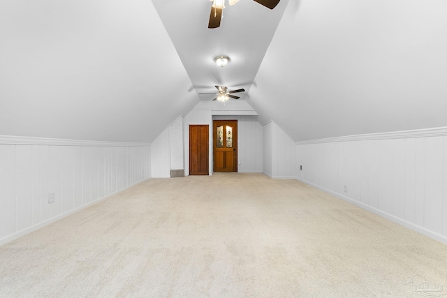 bonus room with carpet, lofted ceiling, and ceiling fan