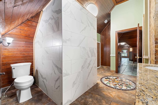 bathroom featuring lofted ceiling, tile walls, wooden ceiling, and toilet