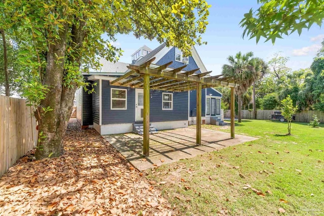 rear view of property featuring a patio, a lawn, and a pergola