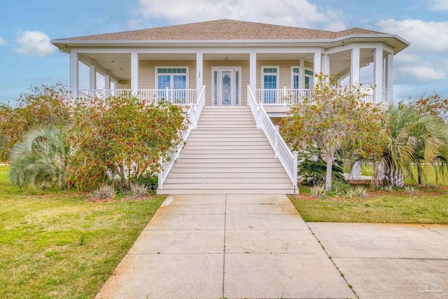 view of front of home featuring a front lawn and covered porch