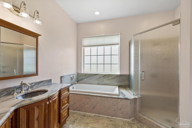 bathroom featuring vanity and plus walk in shower