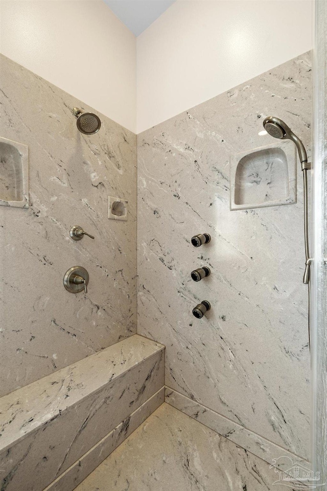 bathroom featuring a tile shower