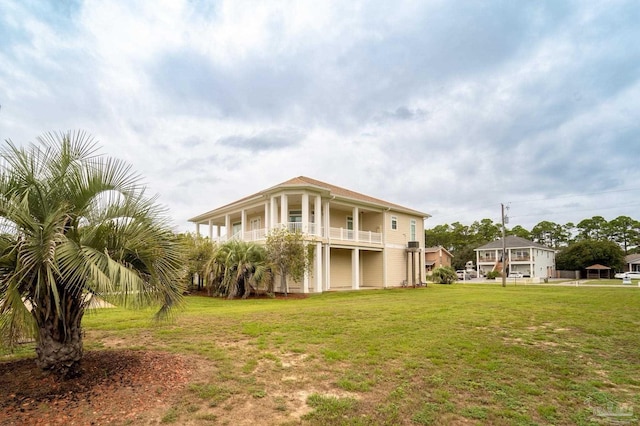 exterior space with a lawn and a balcony