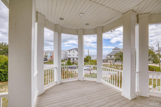 wooden terrace with a porch