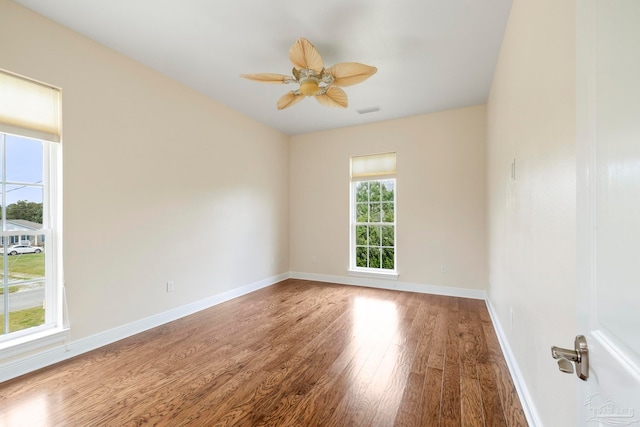 unfurnished room with ceiling fan and hardwood / wood-style floors