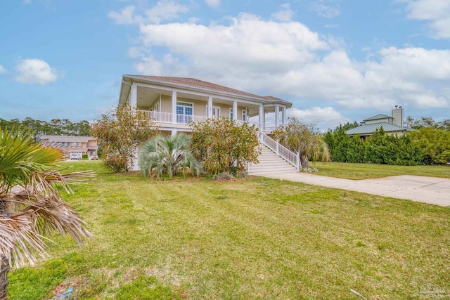 view of front of home featuring a front yard and a porch