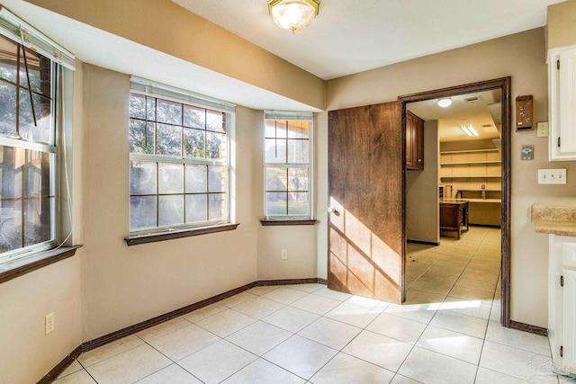 empty room featuring light tile patterned floors