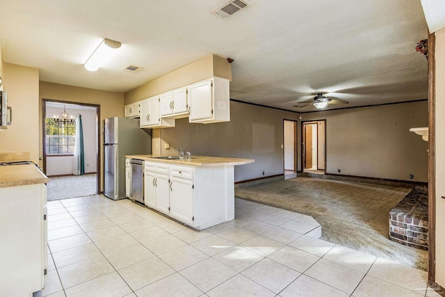 kitchen featuring white cabinetry, sink, light carpet, and appliances with stainless steel finishes