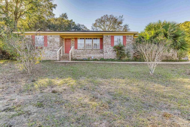 ranch-style home with a front yard