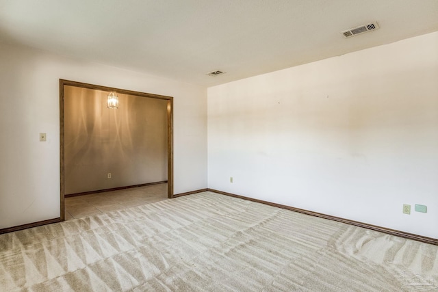 unfurnished bedroom with light carpet and a closet