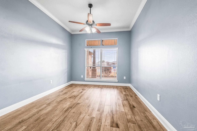 spare room featuring crown molding, ceiling fan, and hardwood / wood-style floors