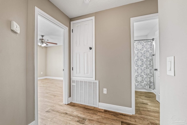 hallway featuring light hardwood / wood-style flooring