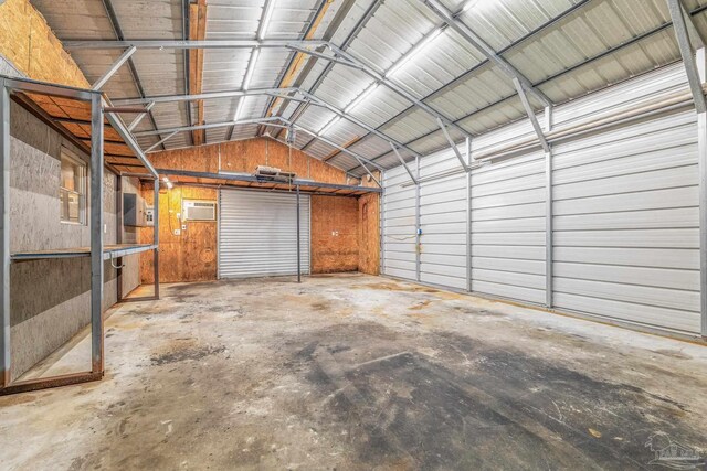 garage featuring a wall mounted air conditioner