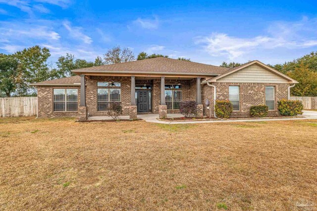 view of front of property with a porch, a front yard, and ceiling fan