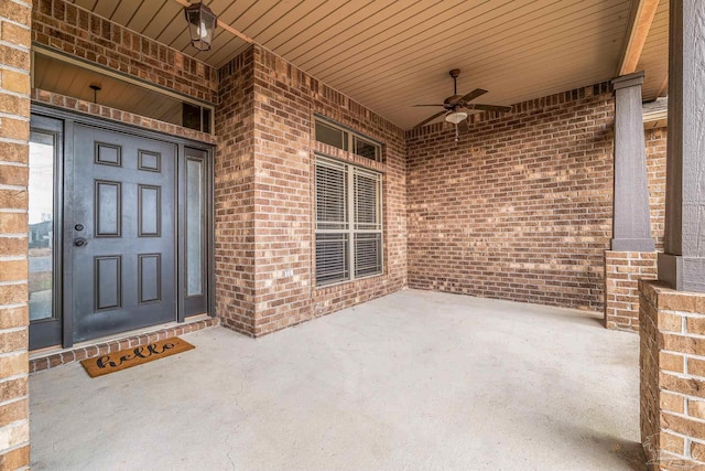 doorway to property with ceiling fan