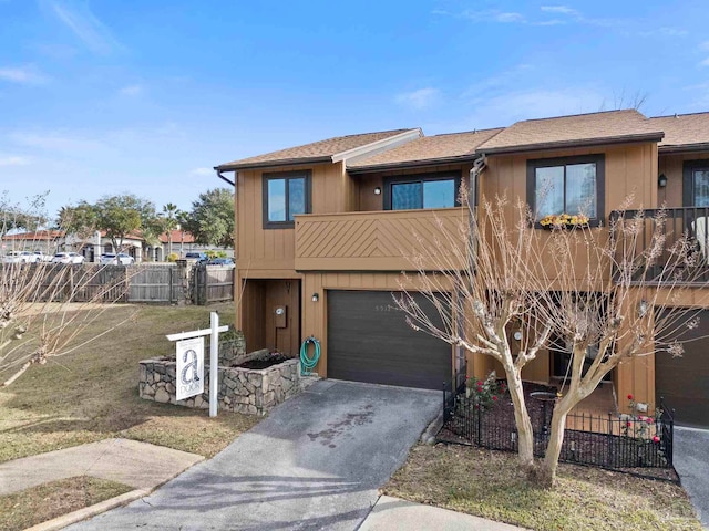 multi unit property featuring a garage