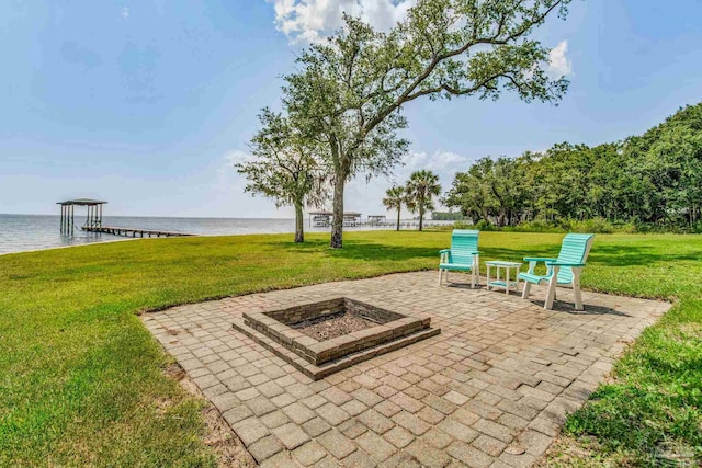 view of patio / terrace with a water view and an outdoor fire pit