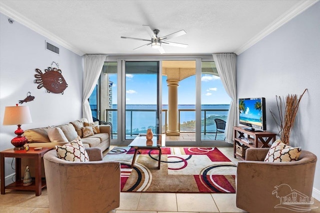 3 Portofino Dr Unit 1705, Pensacola Beach, FL 32561 - living area featuring crown molding, expansive windows, a textured ceiling, a ceiling fan, and healthy amount of natural light