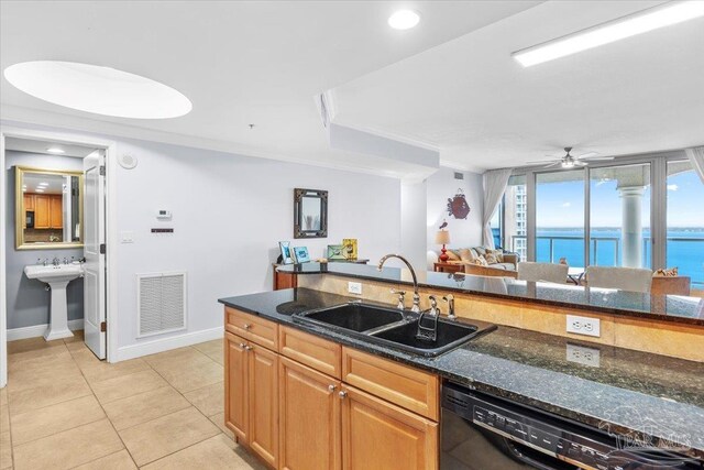 3 Portofino Dr Unit 1705, Pensacola Beach, FL 32561 - kitchen with a sink, dishwasher, dark stone countertops, crown molding, and ceiling fan