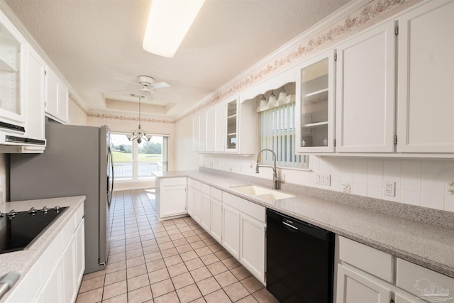 kitchen featuring white cabinets, hanging light fixtures, backsplash, black appliances, and sink