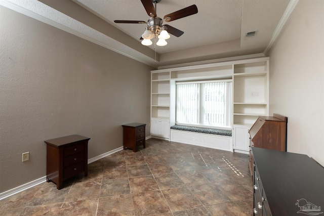 interior space with crown molding, a textured ceiling, and ceiling fan