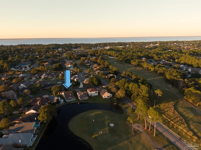 aerial view at dusk with a water view