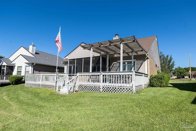 4181 Soundpointe Dr, Gulf Breeze, FL 32563 - rear view of property featuring a lawn, a sunroom, and a deck