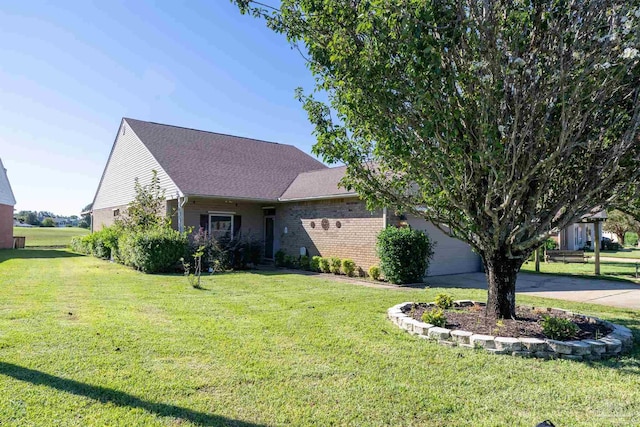 4181 Soundpointe Dr, Gulf Breeze, FL 32563 - view of front of house with driveway, brick siding, a front lawn, an attached garage, and a shingled roof