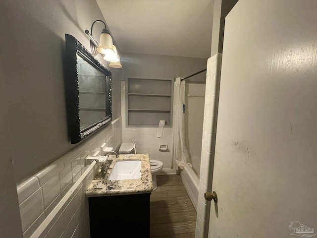 full bathroom with toilet, tasteful backsplash, vanity, shower / bath combo, and hardwood / wood-style flooring