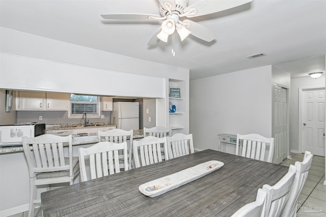 3382 Green Briar Cir, Gulf Breeze, FL 32563 - dining room featuring ceiling fan and light tile patterned floors