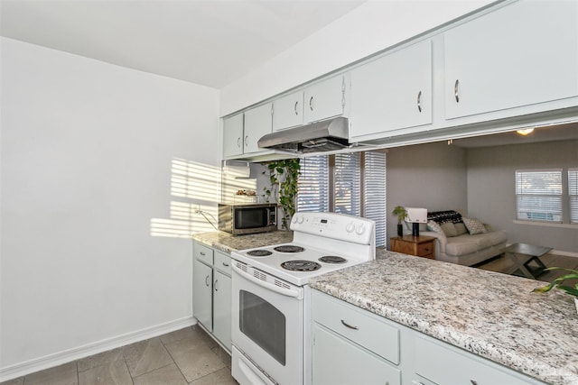 3382 Green Briar Cir, Gulf Breeze, FL 32563 - kitchen with white electric range oven, stainless steel microwave, under cabinet range hood, and healthy amount of natural light