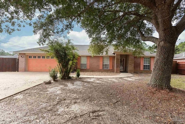 ranch-style house featuring a garage