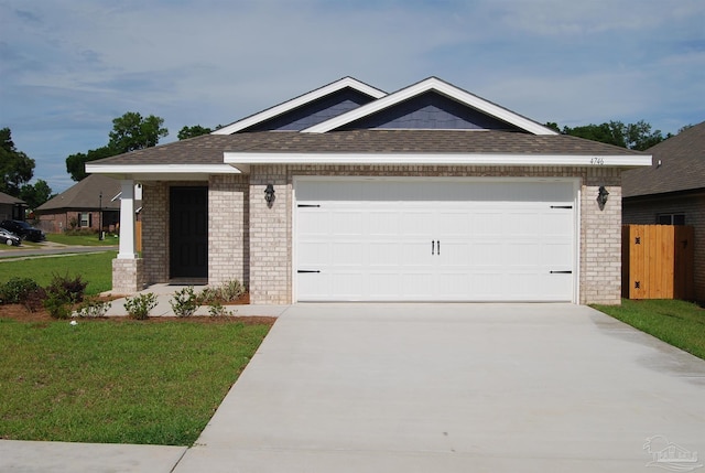 4746 Majestic Palm St, Pace, FL 32571 - view of front of home featuring brick siding, concrete driveway, an attached garage, and a front yard