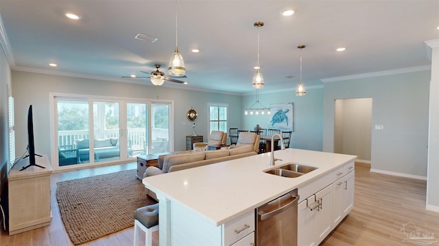 kitchen with dishwasher, sink, white cabinets, a center island with sink, and ceiling fan