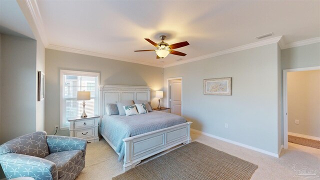 carpeted bedroom featuring ceiling fan and ornamental molding