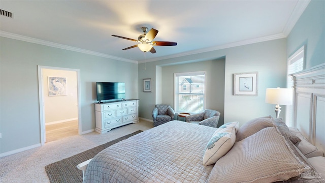 bedroom with ceiling fan, light carpet, and ornamental molding