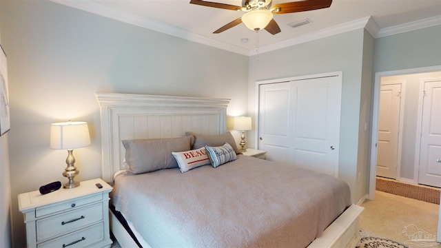 14379 Cordgrass Ln, Pensacola, FL 32507 - bedroom featuring ornamental molding, ceiling fan, visible vents, light carpet, and a closet