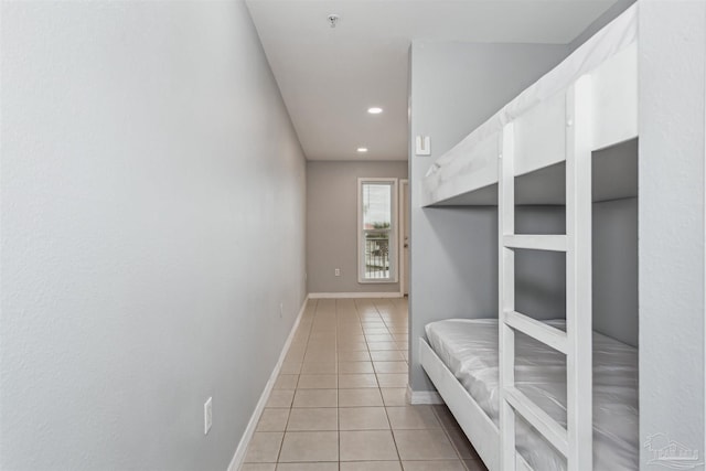 unfurnished bedroom featuring light tile patterned floors