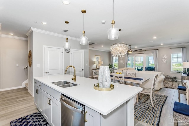 kitchen with sink, hanging light fixtures, a kitchen island with sink, dishwasher, and light hardwood / wood-style floors