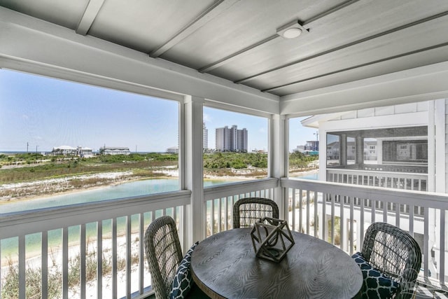 sunroom with a water view