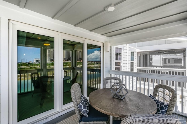 sunroom / solarium with a water view